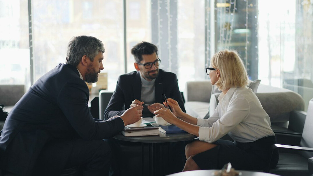 insurance agent discussing policy with client