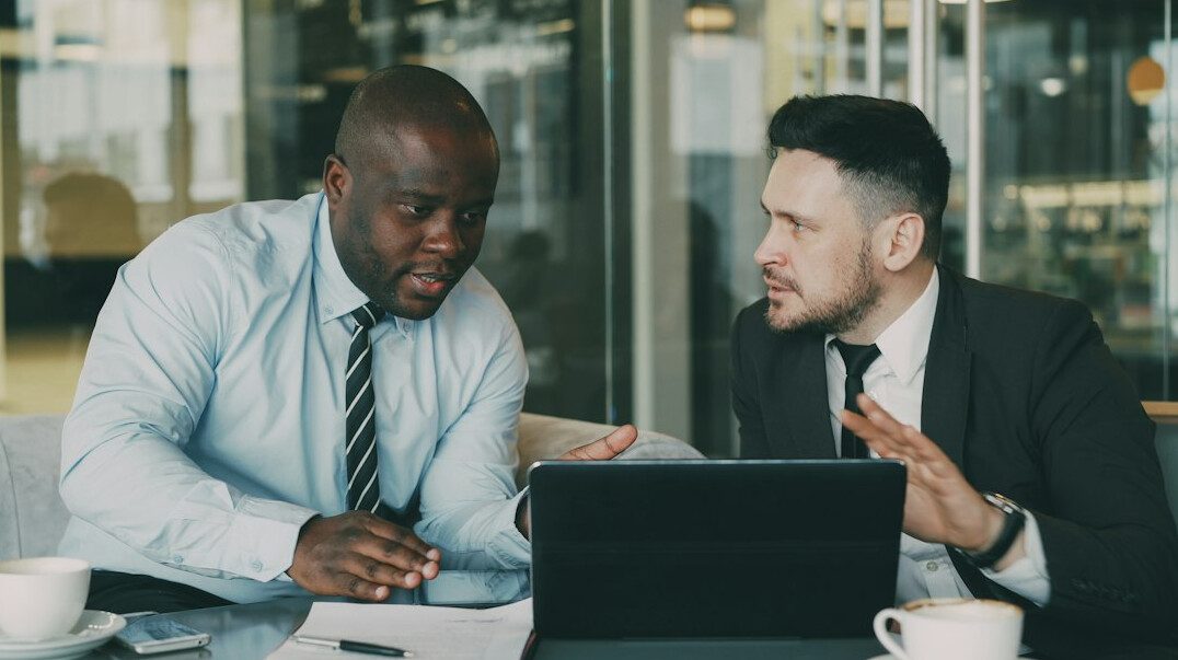 insurance agent discussing policy with client